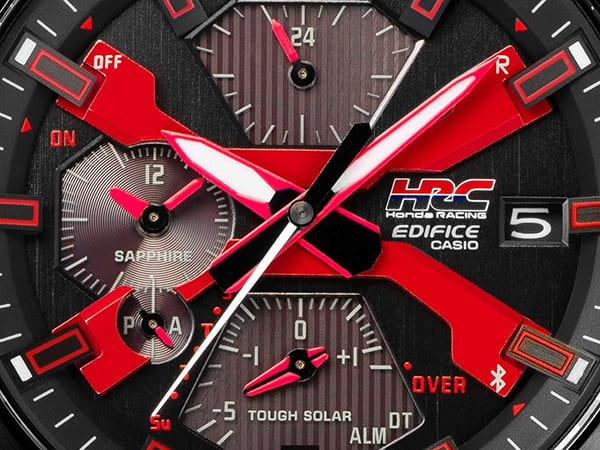 X on dial with paint used for the red Honda badge